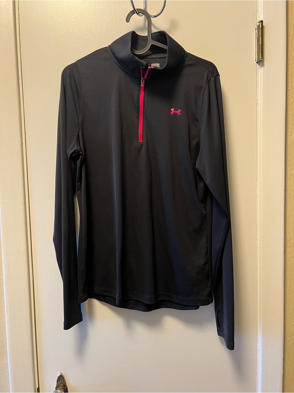 Under Armour Womanโs Black Half-Zip Performance Shirt with Pink Accents